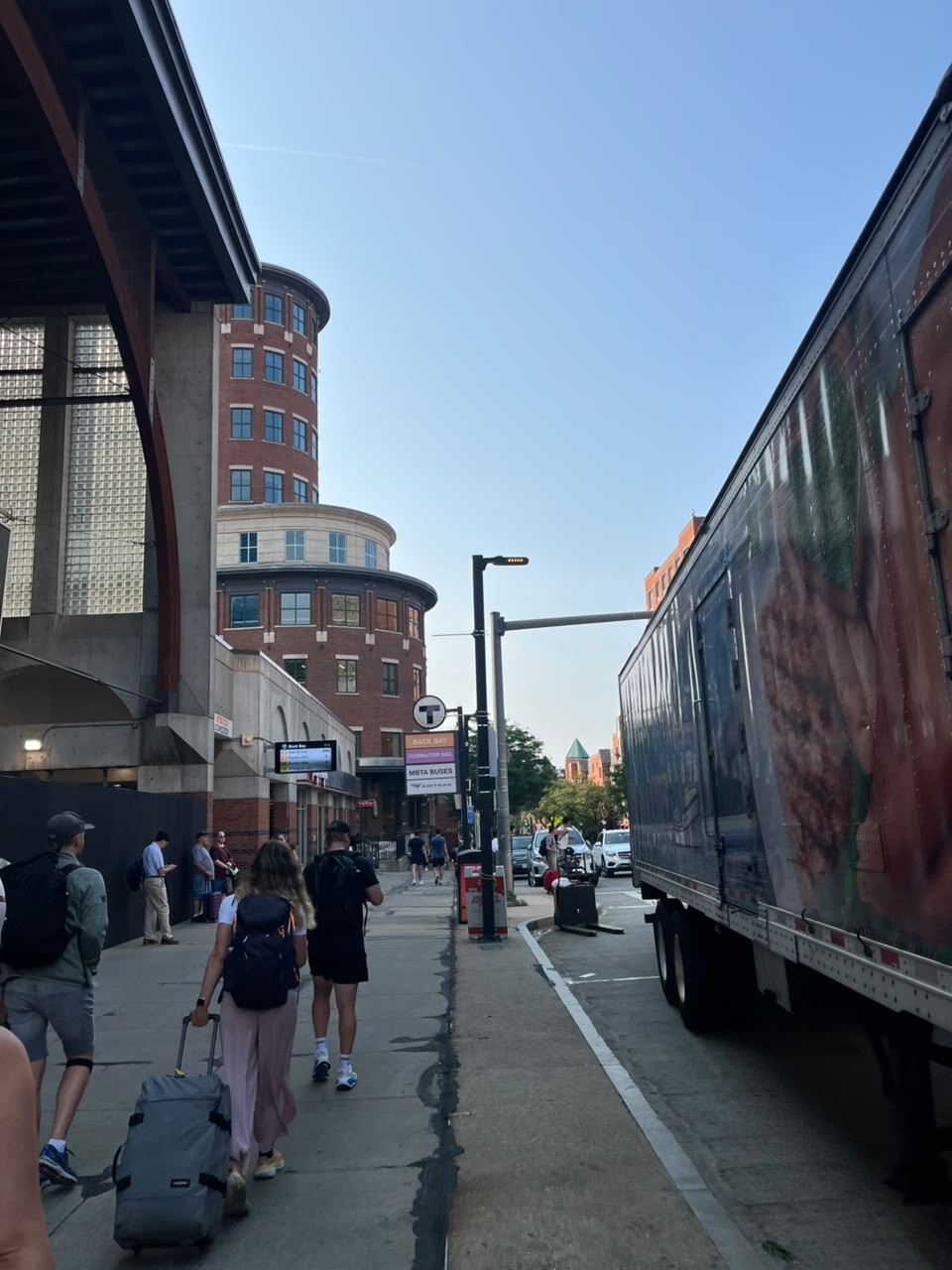 Commuters walking outside Back Bay station