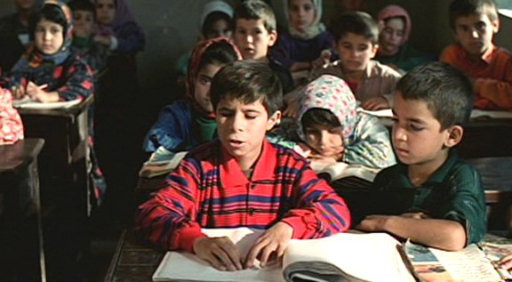 Mohammad reading braille at his special school in Tehran