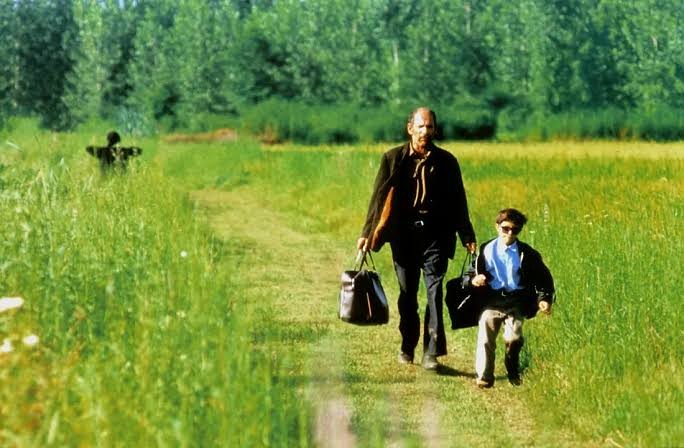 Hashem and Mohammad walking home through the fields